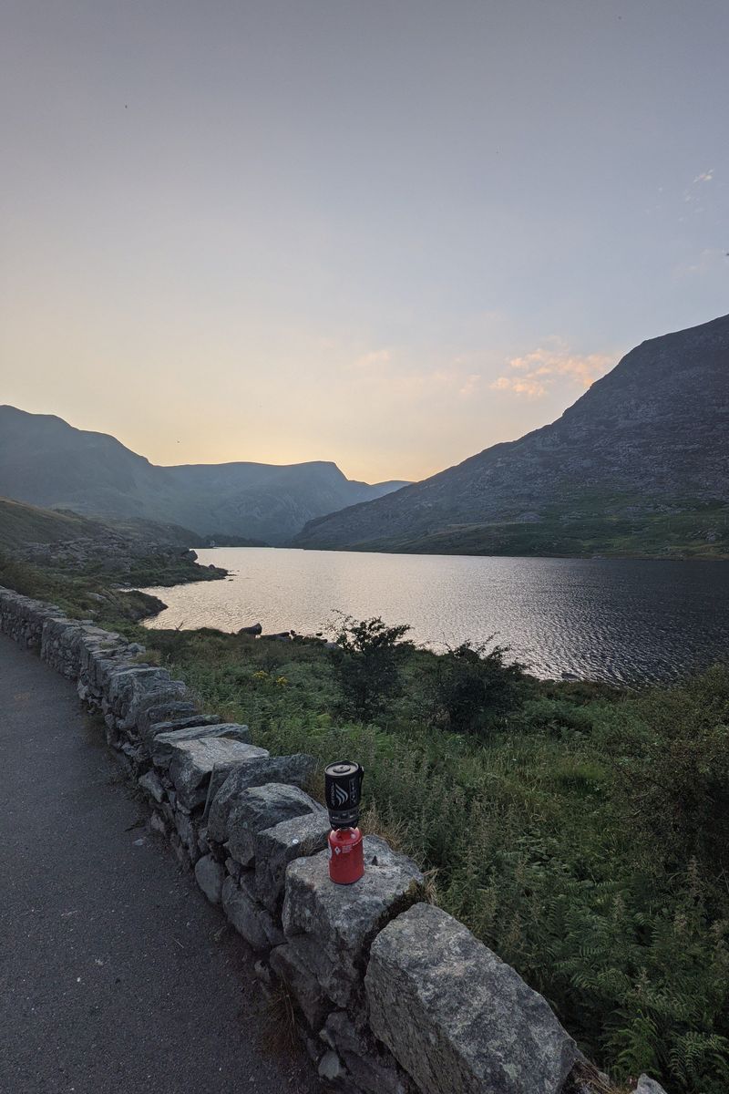 A gas stove in front of Llyn Ogwen