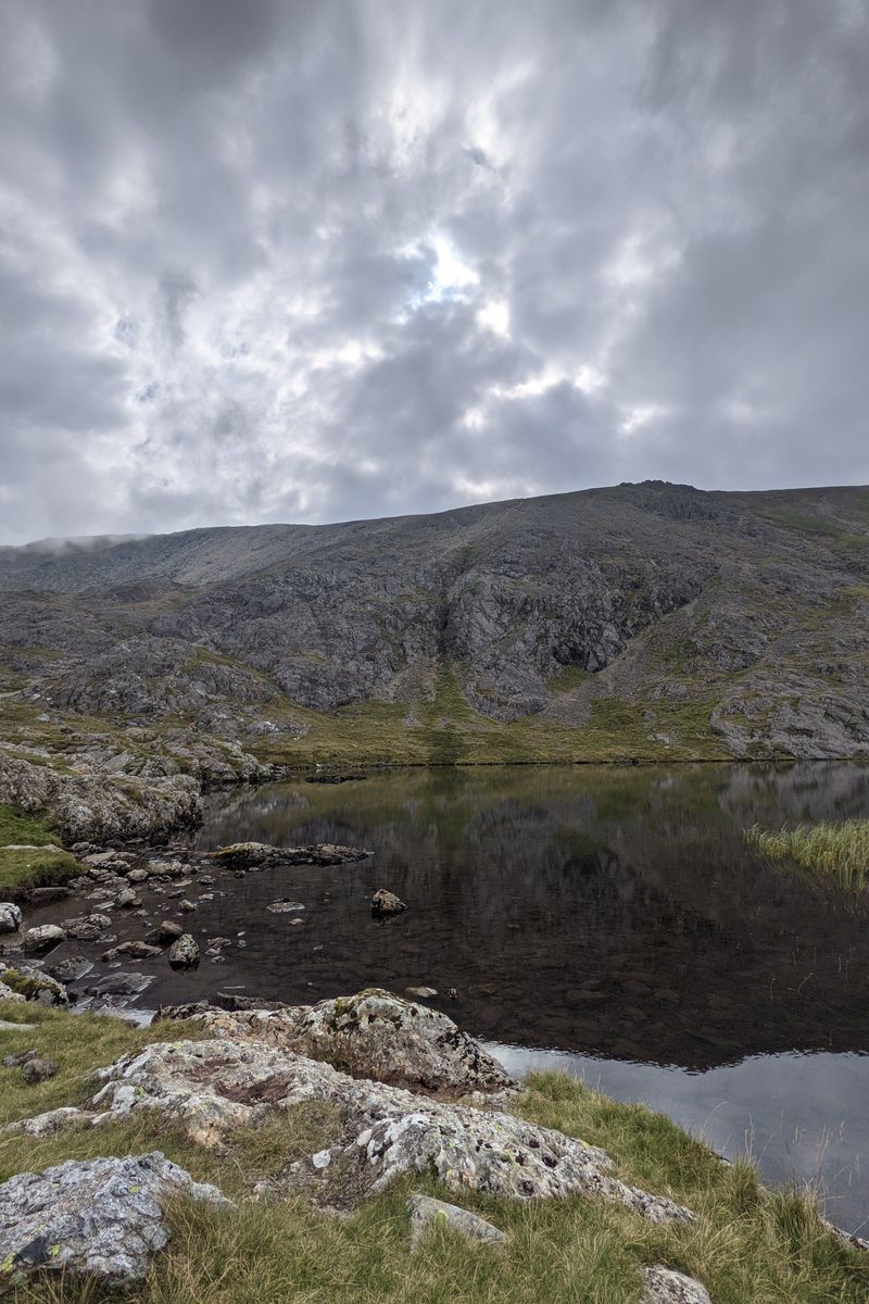 Llyn y Cwn lake with mountains in the background