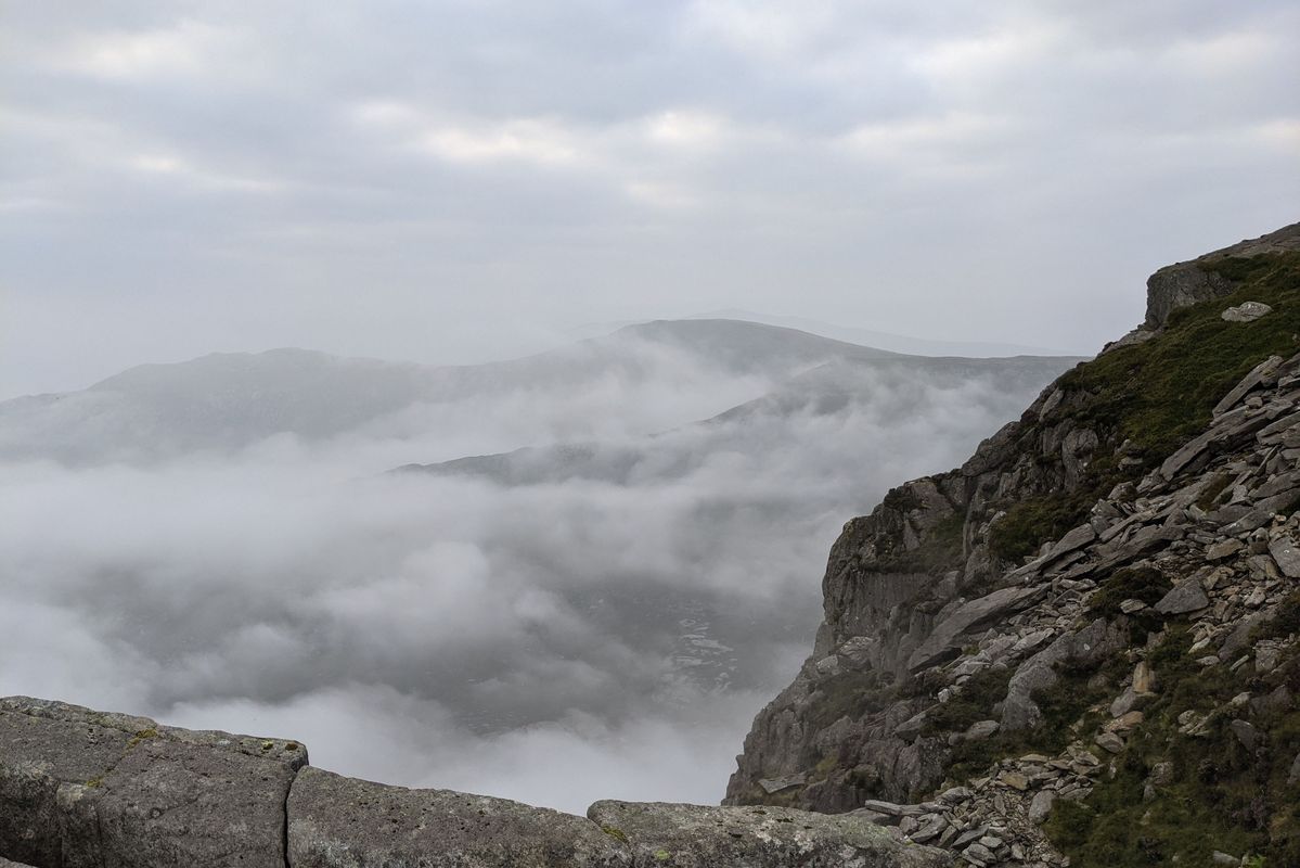 A view across to some mountains covered in mist